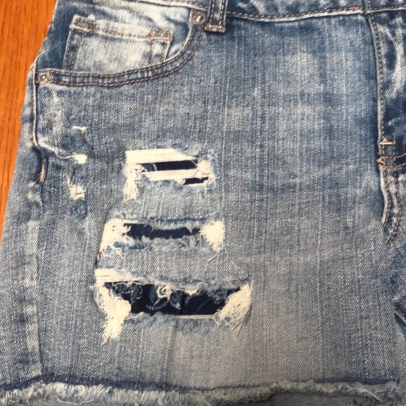 Maurices distressed, patched distressed denim cut off Jean shorts size 3/4 - Picture 2 of 10